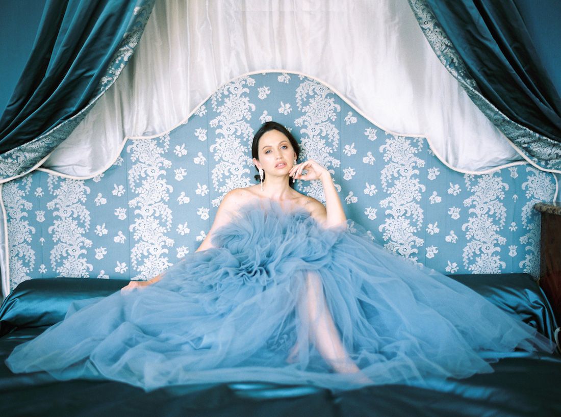 Bride and groom with blue wedding dress at the Chateau de Villette in Paris