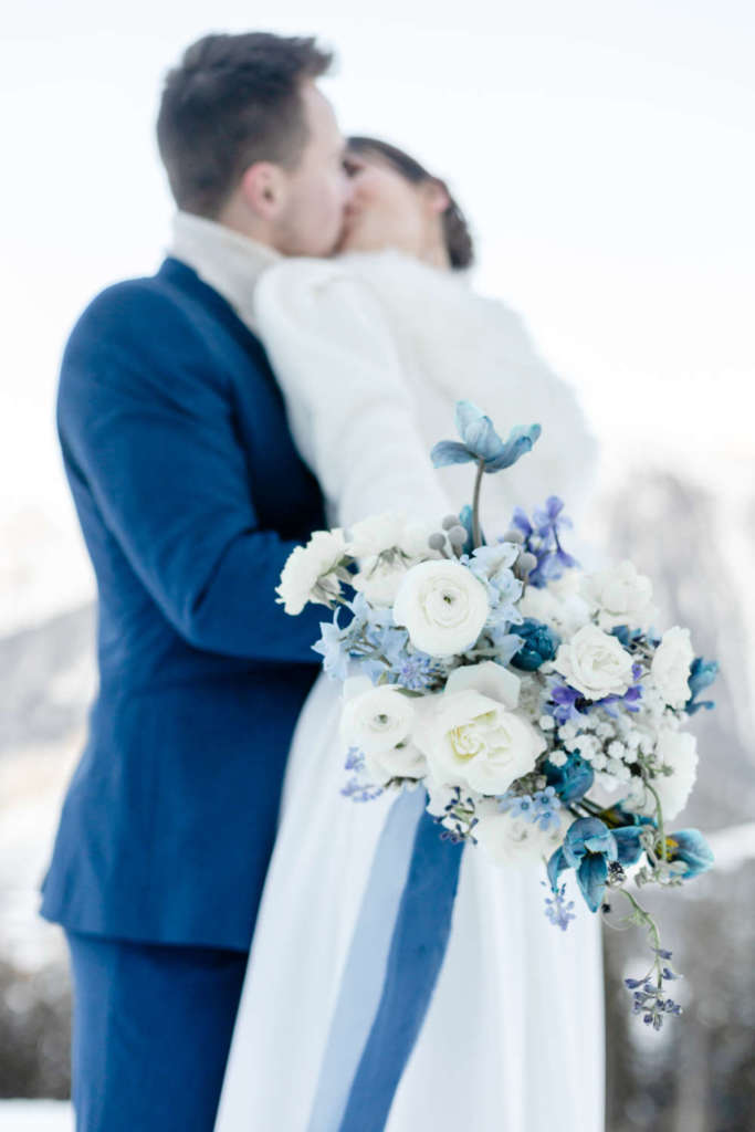 Kiss bride and groom and bouquet